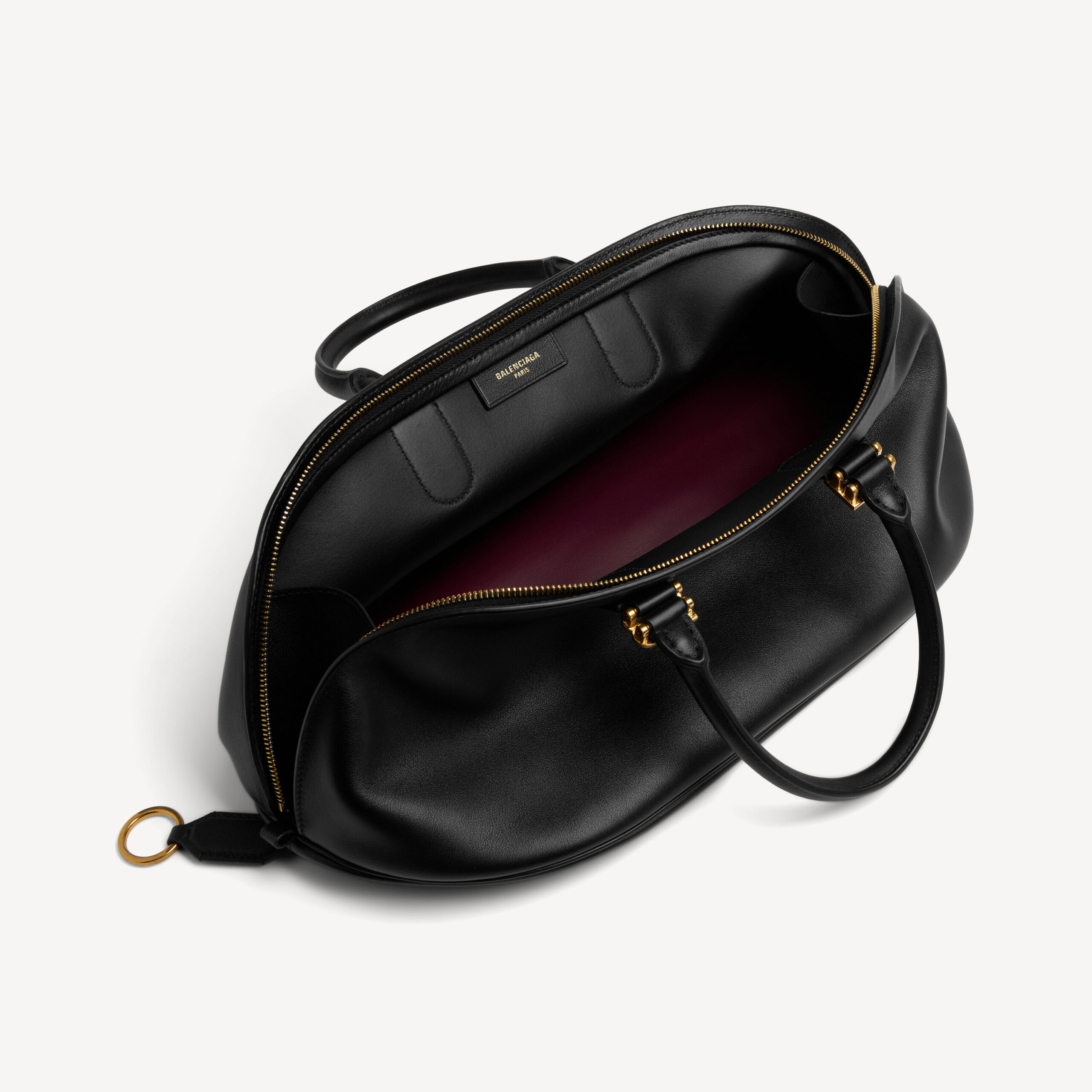 Open main compartment with contrasting plum lining, $3,950